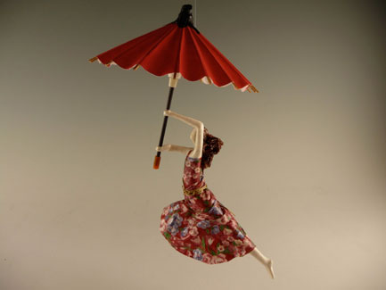 Umbrella Figure Handmade with Sealed Paper and Fabric. Measures 9 Inches Long and 5 Inches Wide.